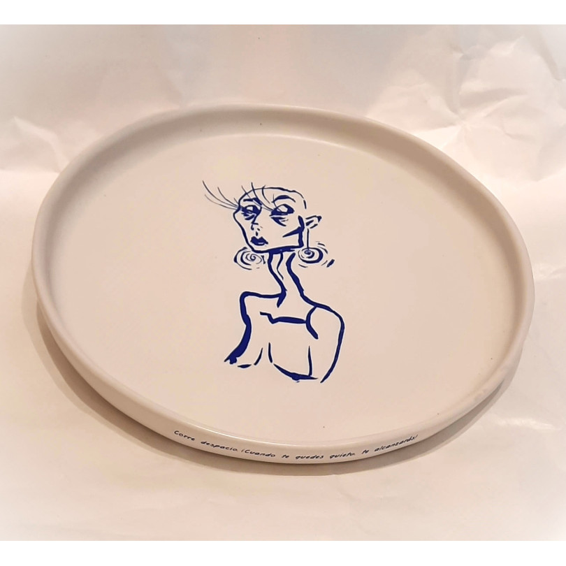 ceramic plate with blue drawing and poem