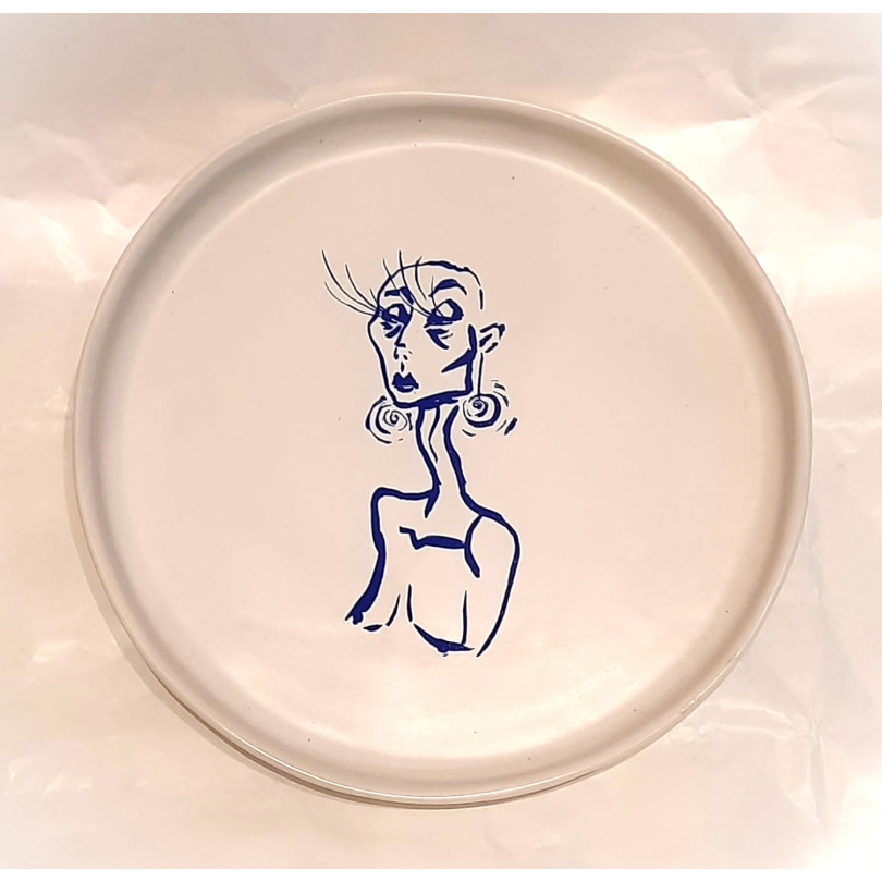 ceramic plate with blue drawing and poem