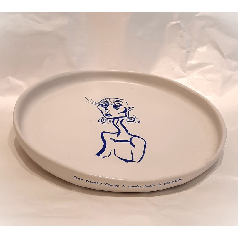 ceramic plate with blue drawing and poem