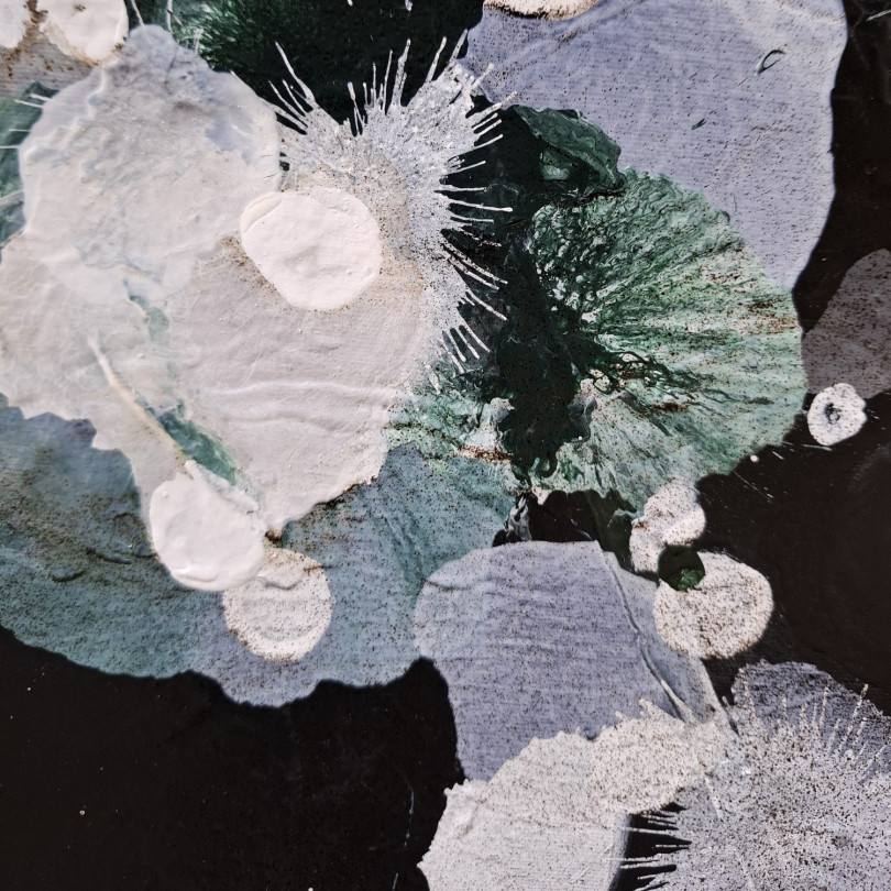 Abstract artwork on a black background with white flowers by Martinez Marín