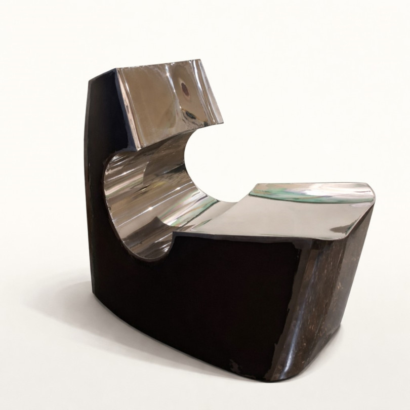 Contemporary low chair in stainless steel and black steel