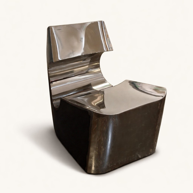 Contemporary low chair in stainless steel and black steel