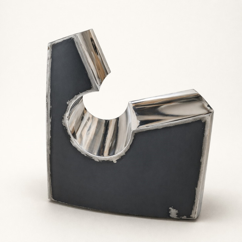 Contemporary low chair in stainless steel and black steel