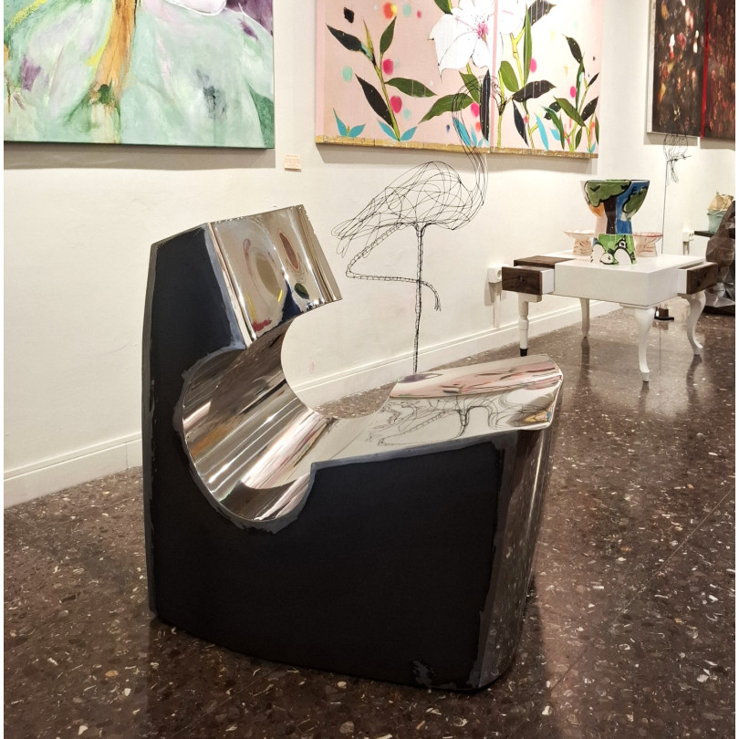 Contemporary low chair in stainless steel and black steel