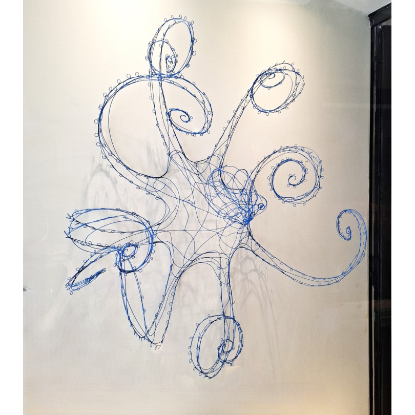Wall sculpture: blue octopus, made of blue lacquered wire