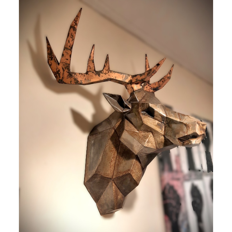 Deer head trophy sculpture in patinated steel.